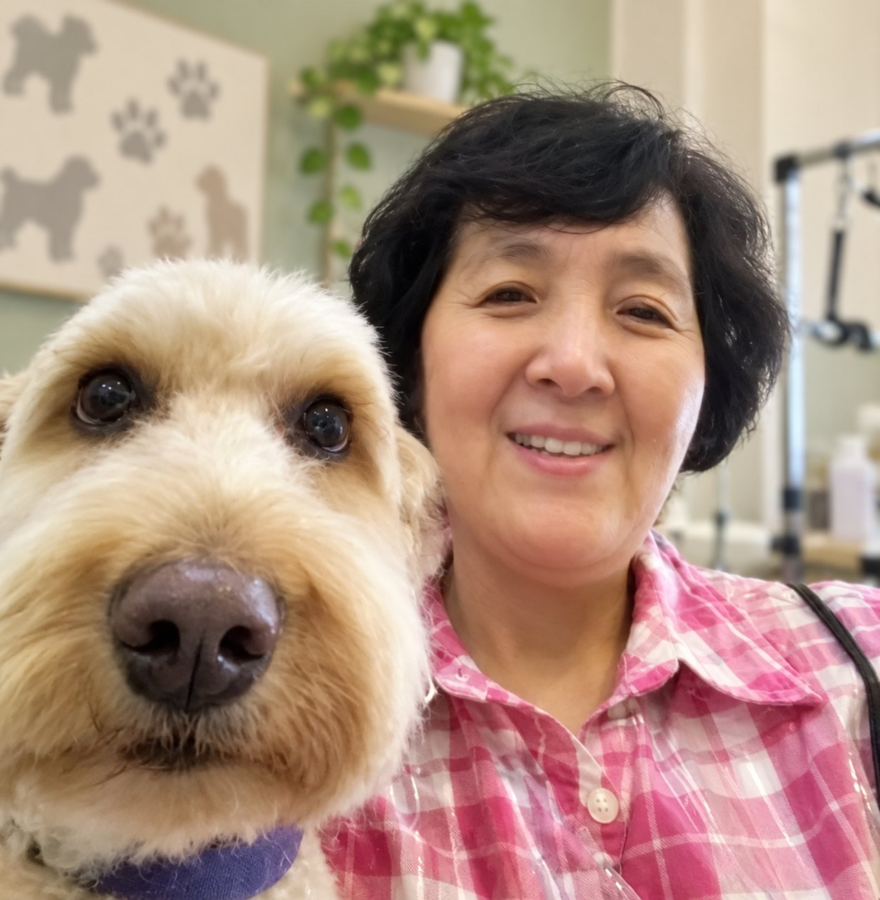 Ellen with a fluffy cream dog